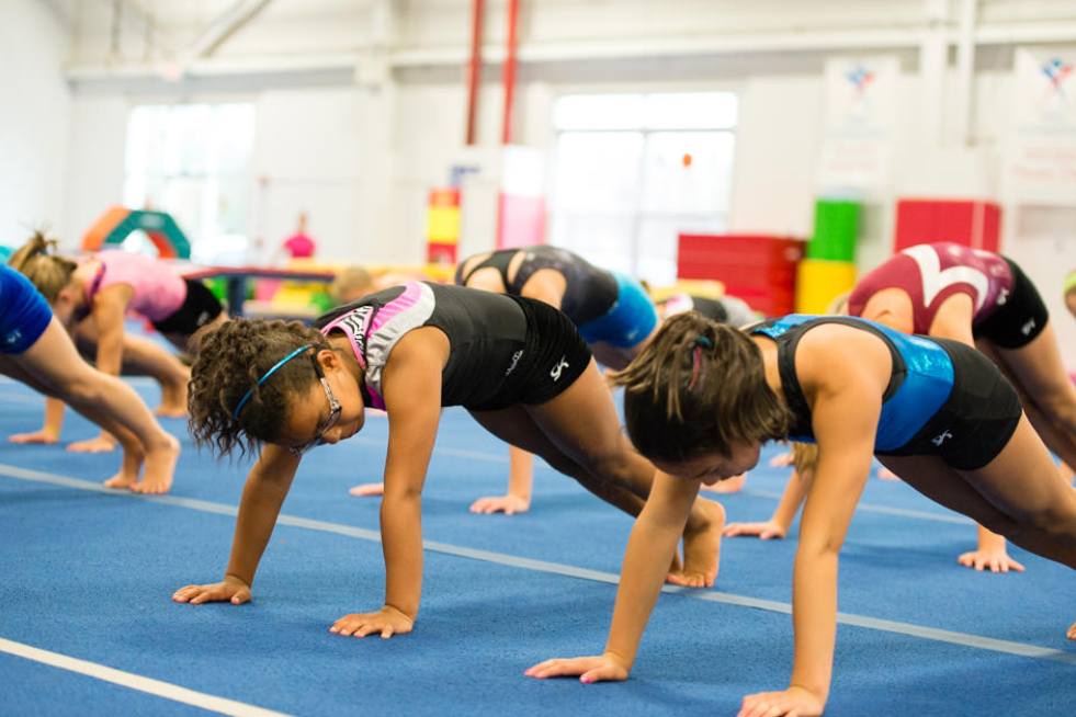 a group of children doing push ups