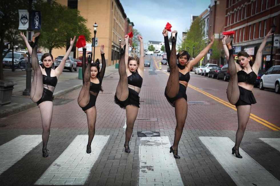 5 Women dancing on a zebra crossing